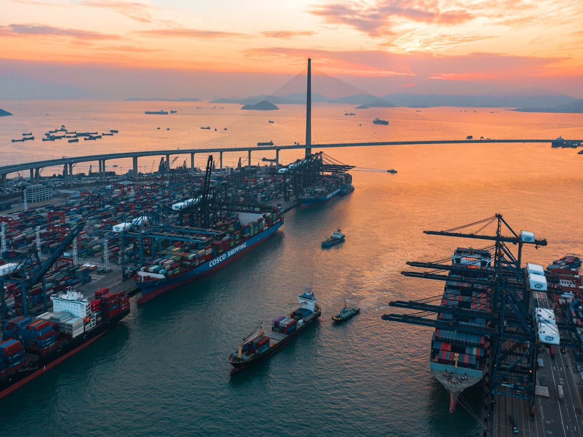 The Hong Kong container port and suspension bridge at sunset