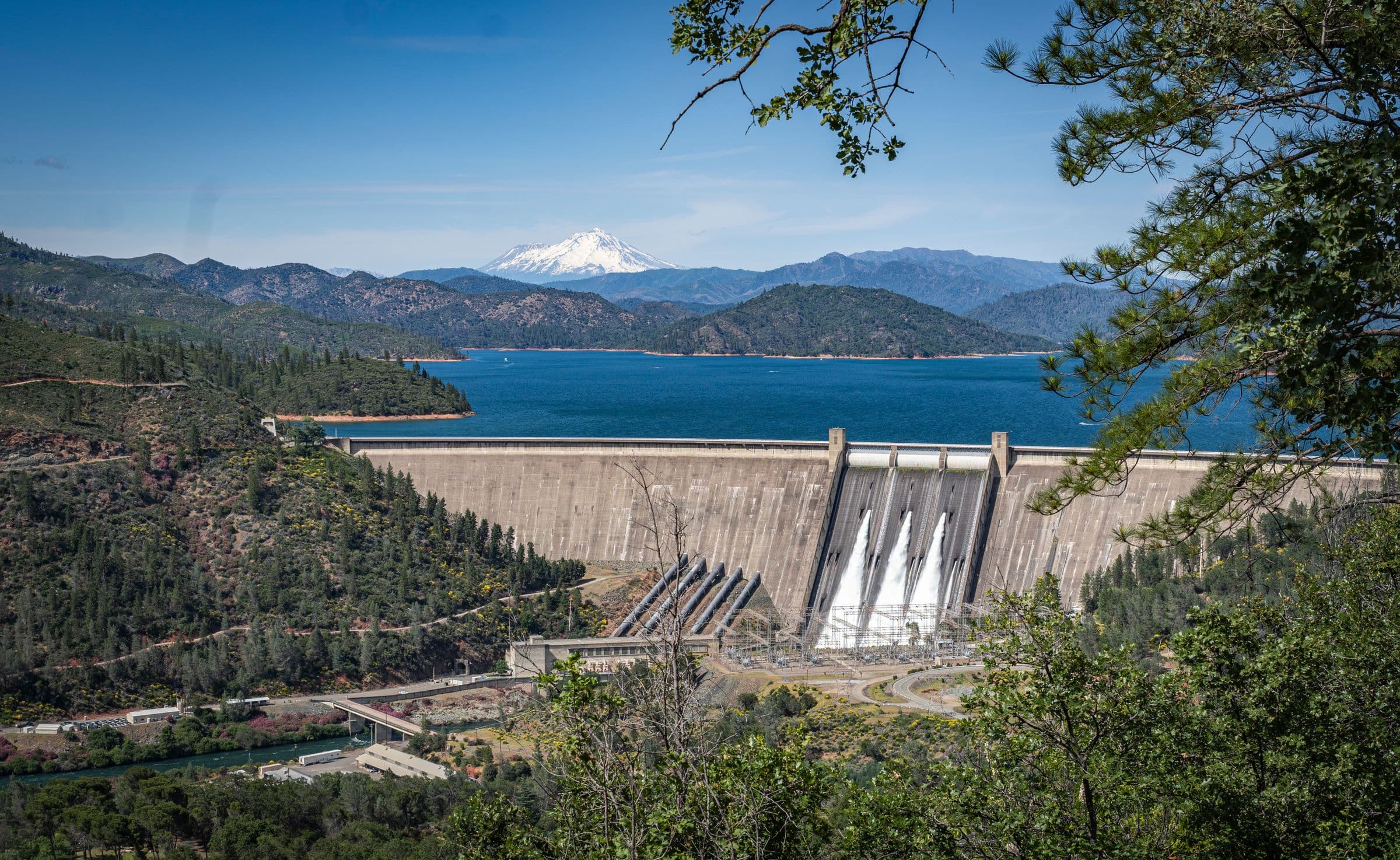 Shasta Dam and its reservoir with Mount Shasta rising behind